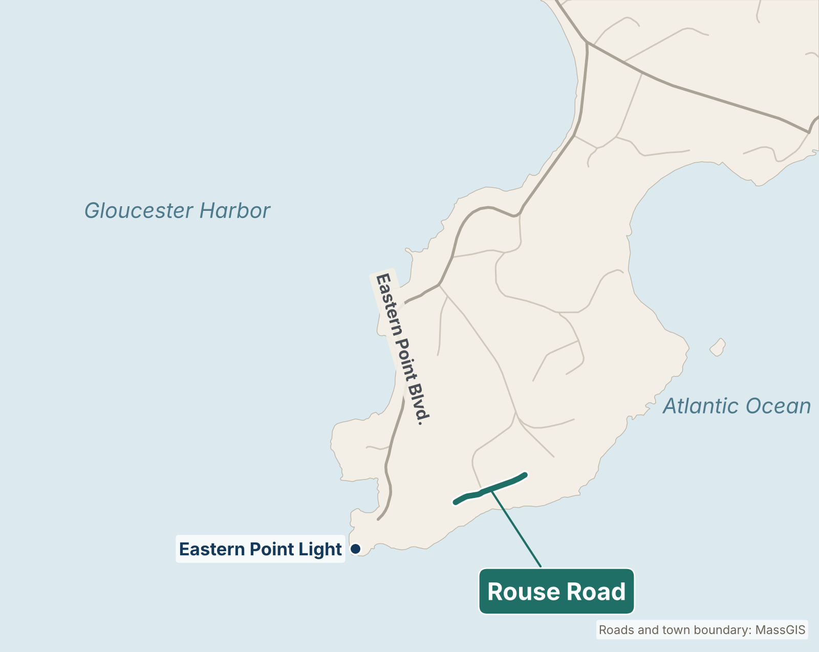 Map of the Eastern Point area of Gloucester showing Rouse Road highlighted in teal near the southern tip, off Eastern Point Boulevard, with Gloucester Harbor to the west, the Atlantic Ocean to the east and Eastern Point Light at the point.