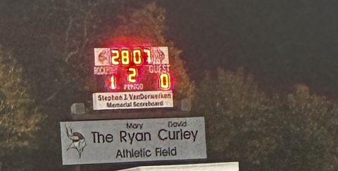 The Rockport High scoreboard shows Rockport 1, Guest 0 in the second half above the Ryan Curley Athletic Field sign