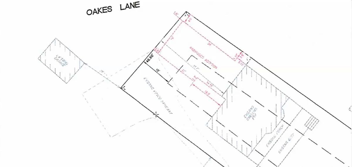 A site plan drawing showing an existing house, an existing garage and a proposed addition outlined in red, with the paper road Oakes Lane along the back of the lot.