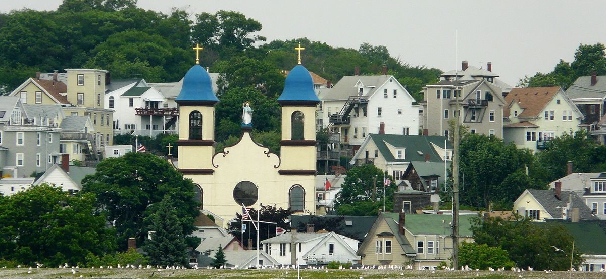 Our Lady of Good Voyage Church and its two blue domed bell towers above the Gloucester waterfront